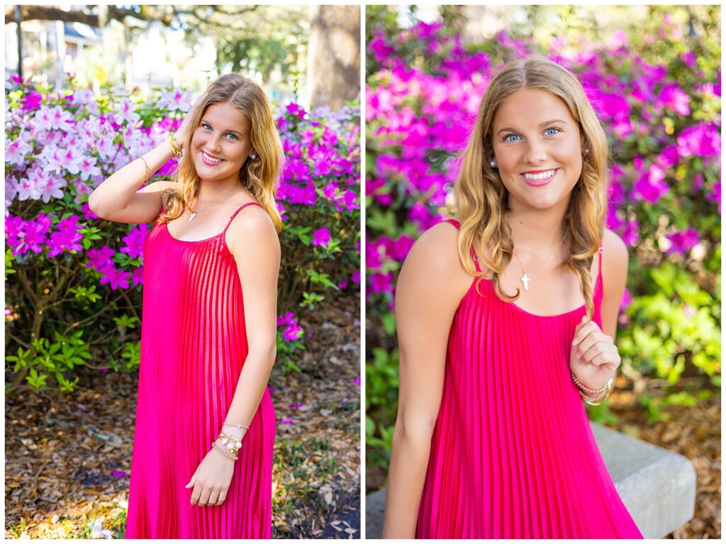 High school senior girl in a vibrant pink dress smiling and posing in front of blooming azalea bushes during a spring senior photo session in Savannah, GA.